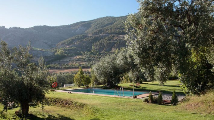 Piscina con vistas a Sierra Nevada Hotel La Almunia del Valle